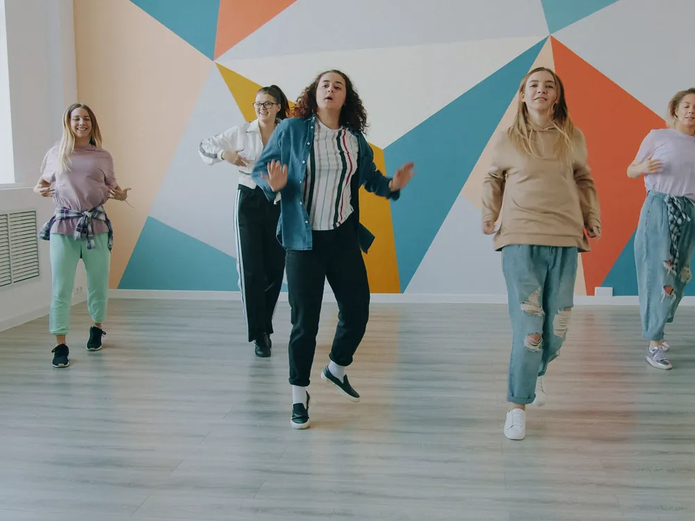 Adults dancing in a bright studio