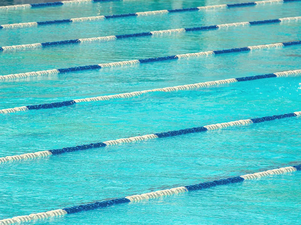 Pool lane ropes across clear water