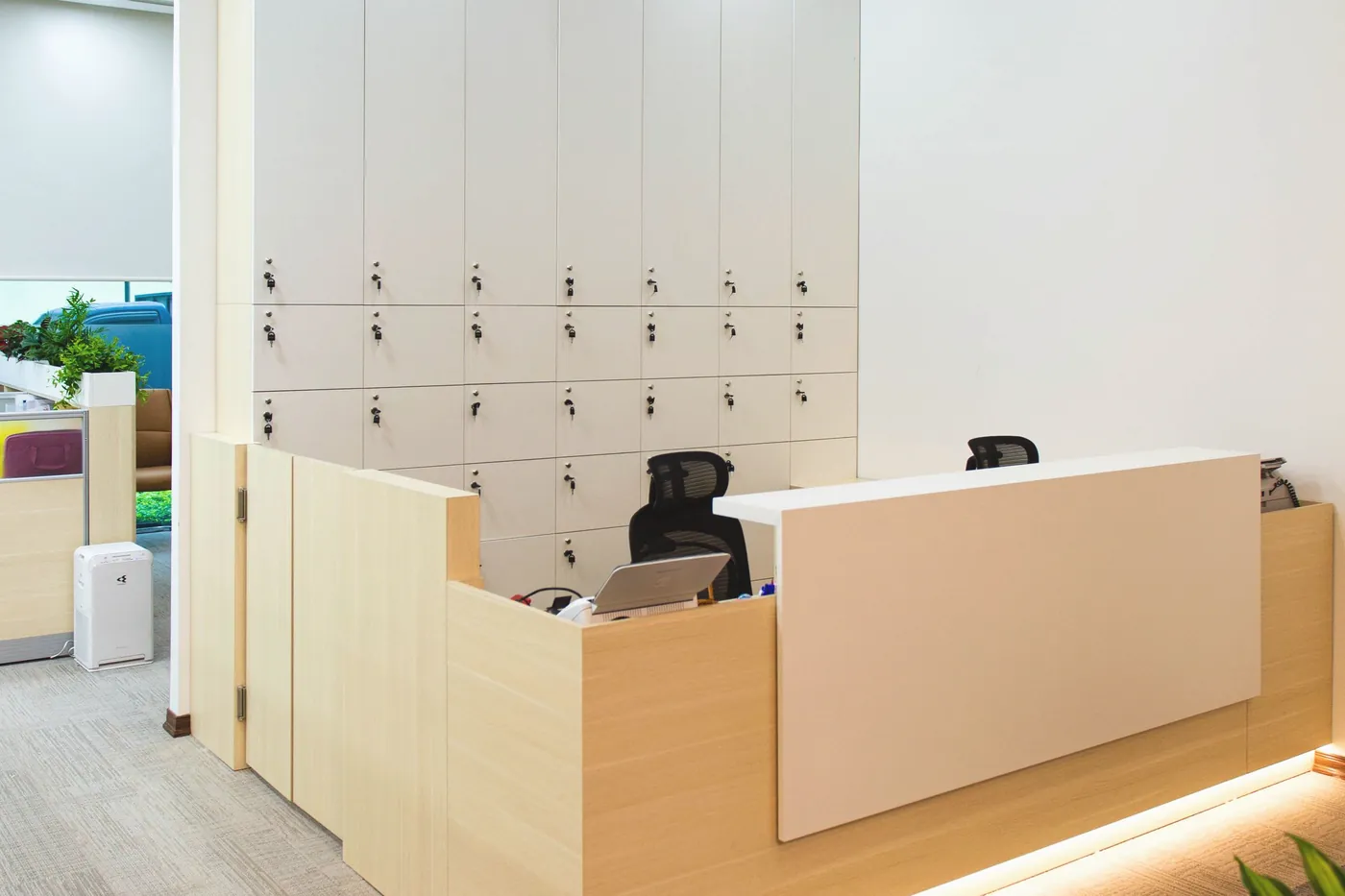 A reception desk with lockers behind it