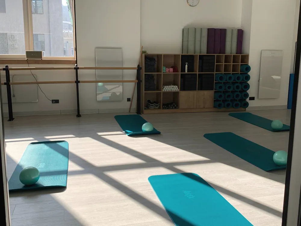 Exercise mats on a sunlit floor