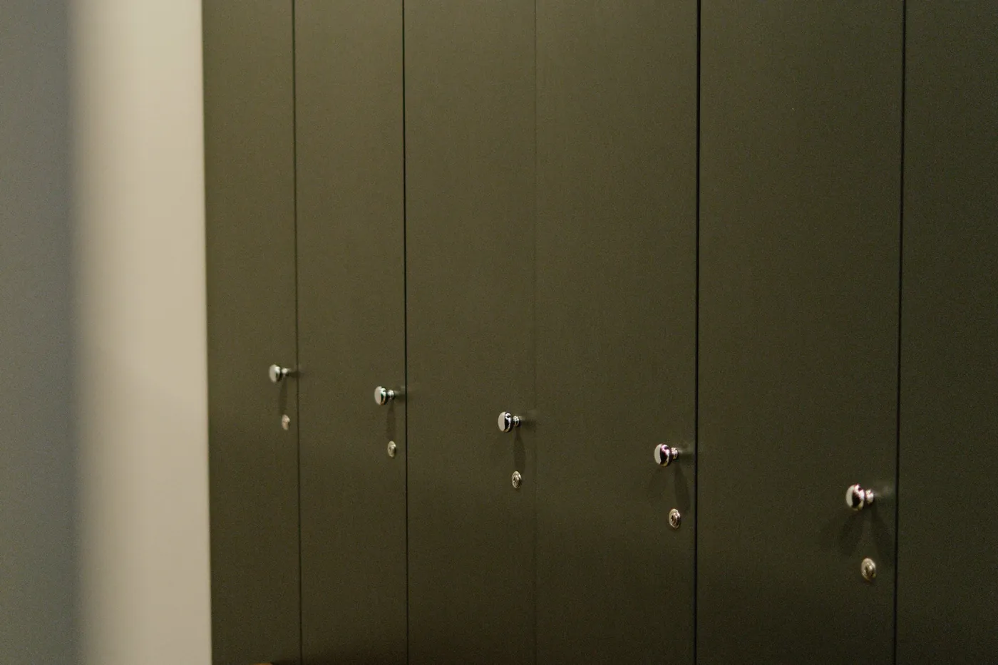 A changing area with lockers and a bench