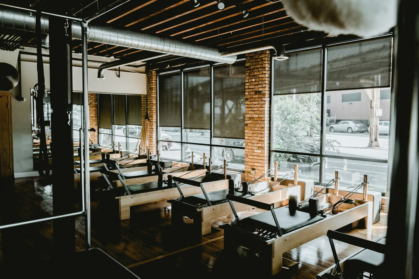 A training floor by tall windows