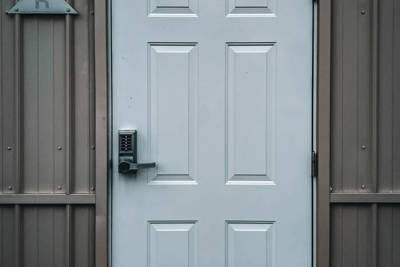 A pale door with a lock