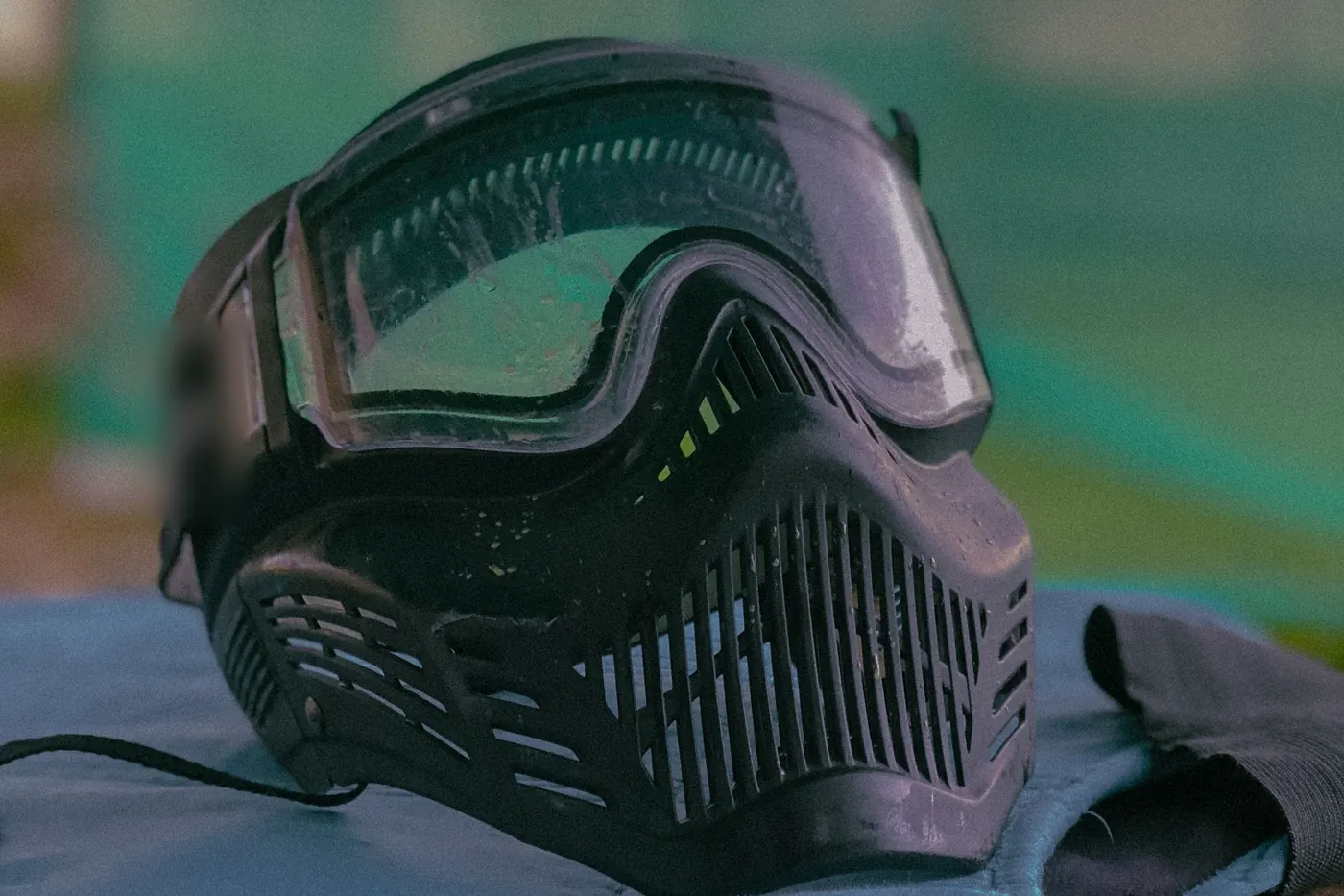 A paintball mask on a bench, ready for the day