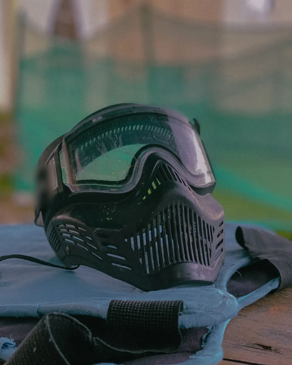 A paintball mask resting on a bench in the safe zone