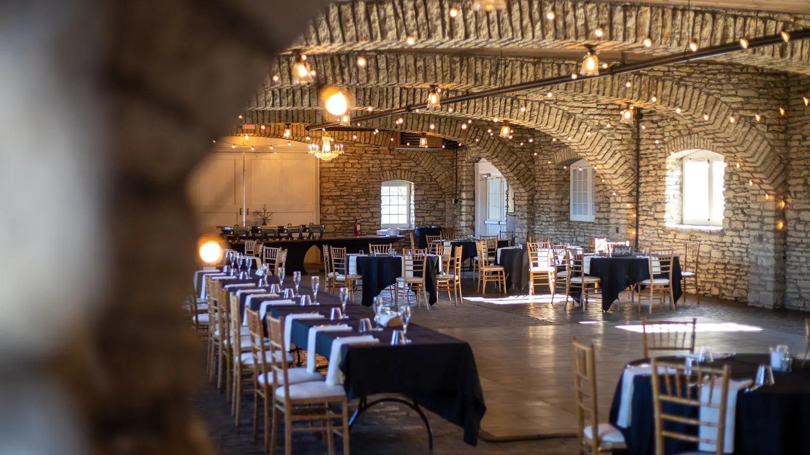 An empty room with chairs and tables arranged for a group